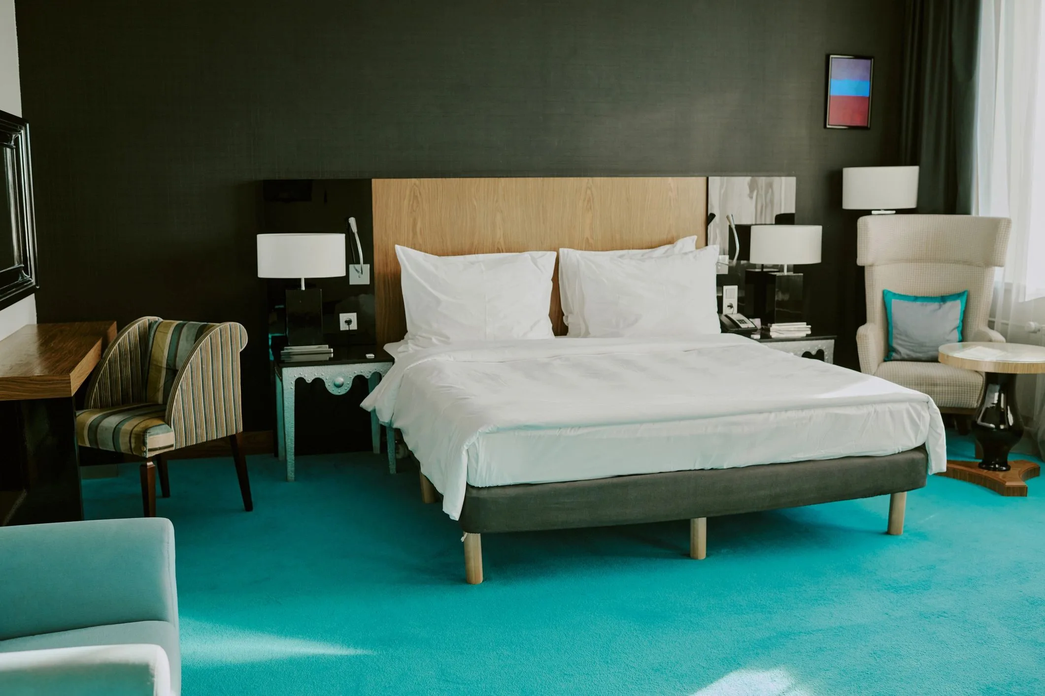 Guest room bed with bedside tables (representative image)